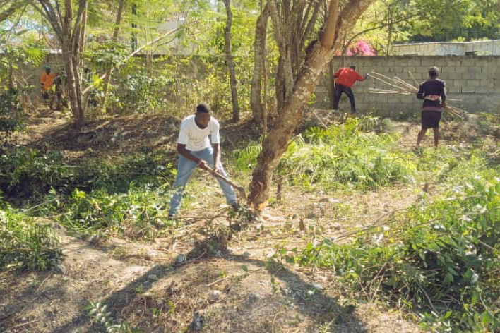 Haitian volunteer clearing ground for the new teaching hospital